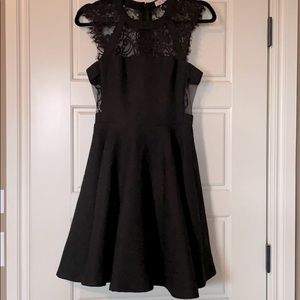 Black cocktail dress with lace detail